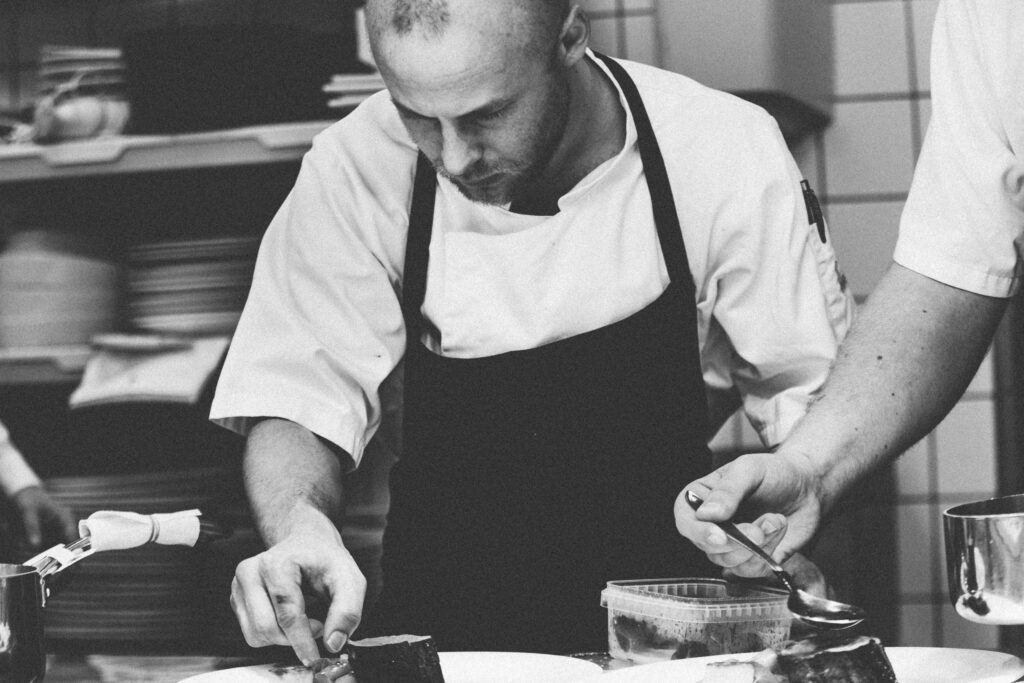 Restaurant executive chef preparing a gourmet meal casual dining gecko hospiality